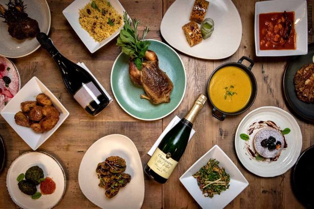 A luxurious spread of contemporary Indian dishes including rich curries, fragrant biryani, and freshly baked naan, prepared for an Easter celebration at our Petts Wood restaurant.