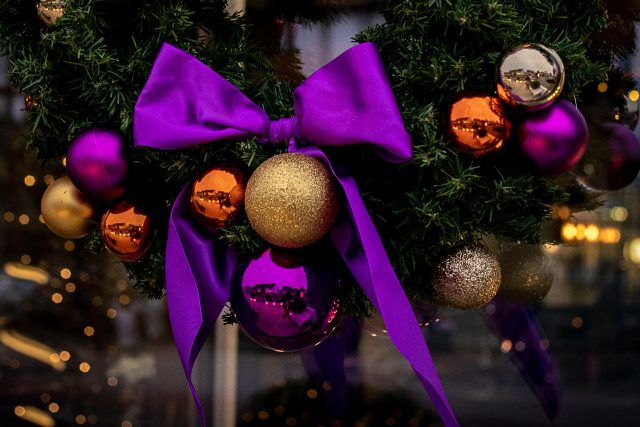 A festive Christmas wreath adorned with a rich purple bow and elegant ornaments, setting a welcoming holiday atmosphere at our contemporary Indian restaurant in Petts Wood.