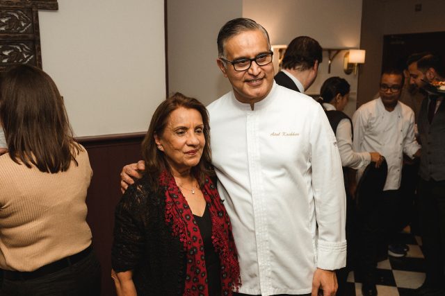 Guests interacting with twice Michelin-starred Chef Atul Kochhar at Indian Essence.
