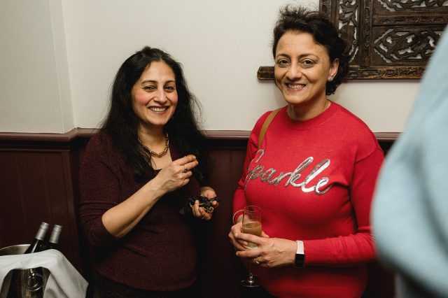 Co-owner Jitindar Singh raising a toast with patrons at the Indian Essence party.