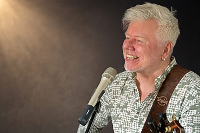 Musician Gordon Mark Webber performing acoustic live music at Indian Essence restaurant in Orpington.